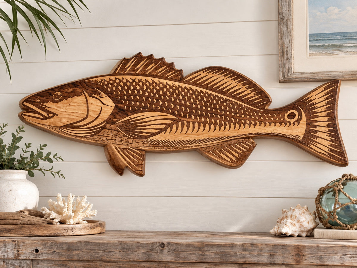27-inch engraved oak redfish displayed in a coastal setting