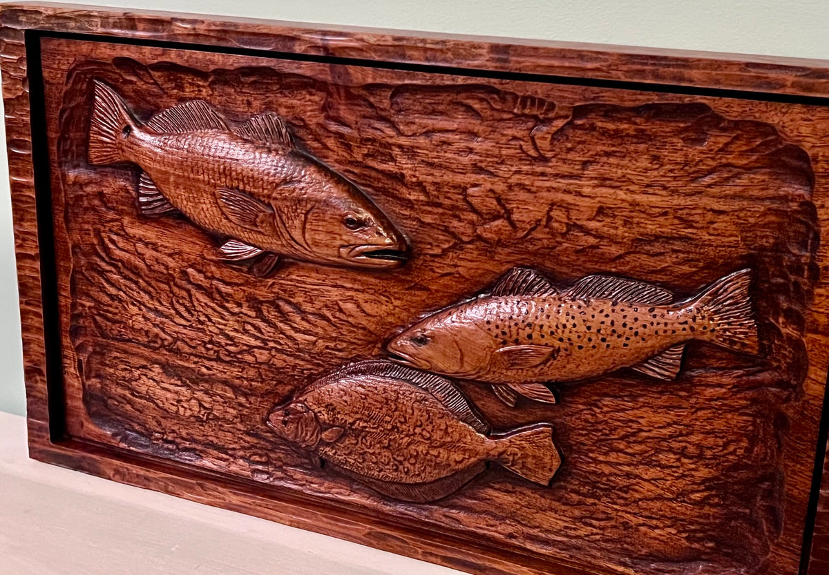 Angled view of Lowcountry fish wood relief