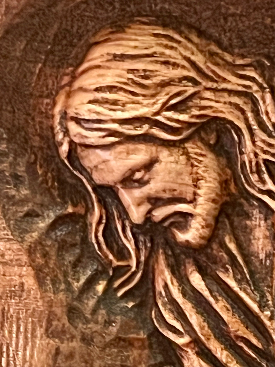 Close detail of Jesus in Good Shepherd carving
