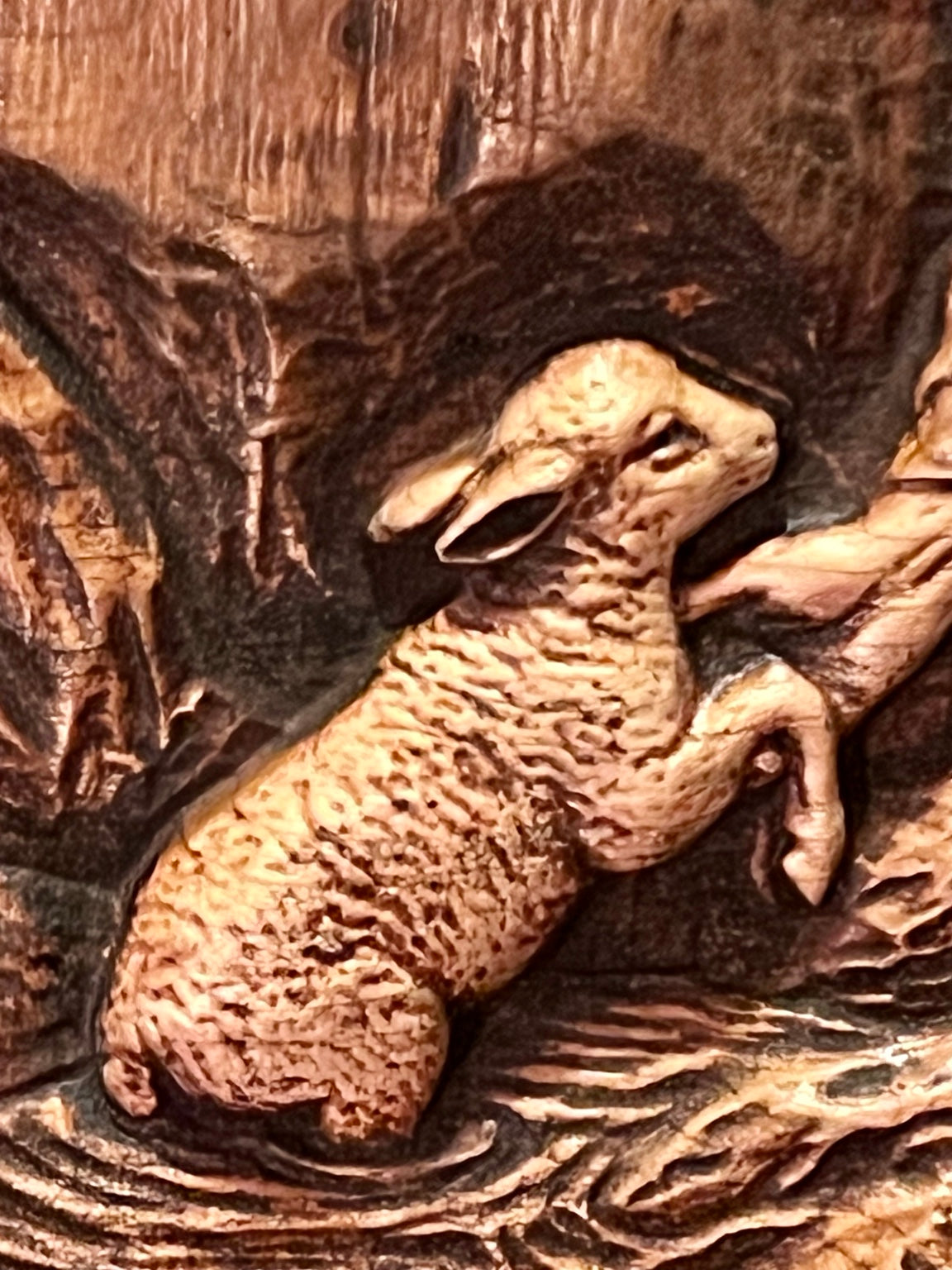 Close detail of lamb in Good Shepherd carving