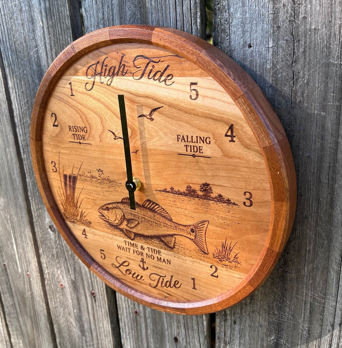 Angled view of the redfish tide clock showing the segmented sapele ring