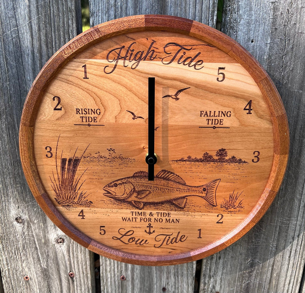 Front view of the redfish tide clock with segmented sapele ring
