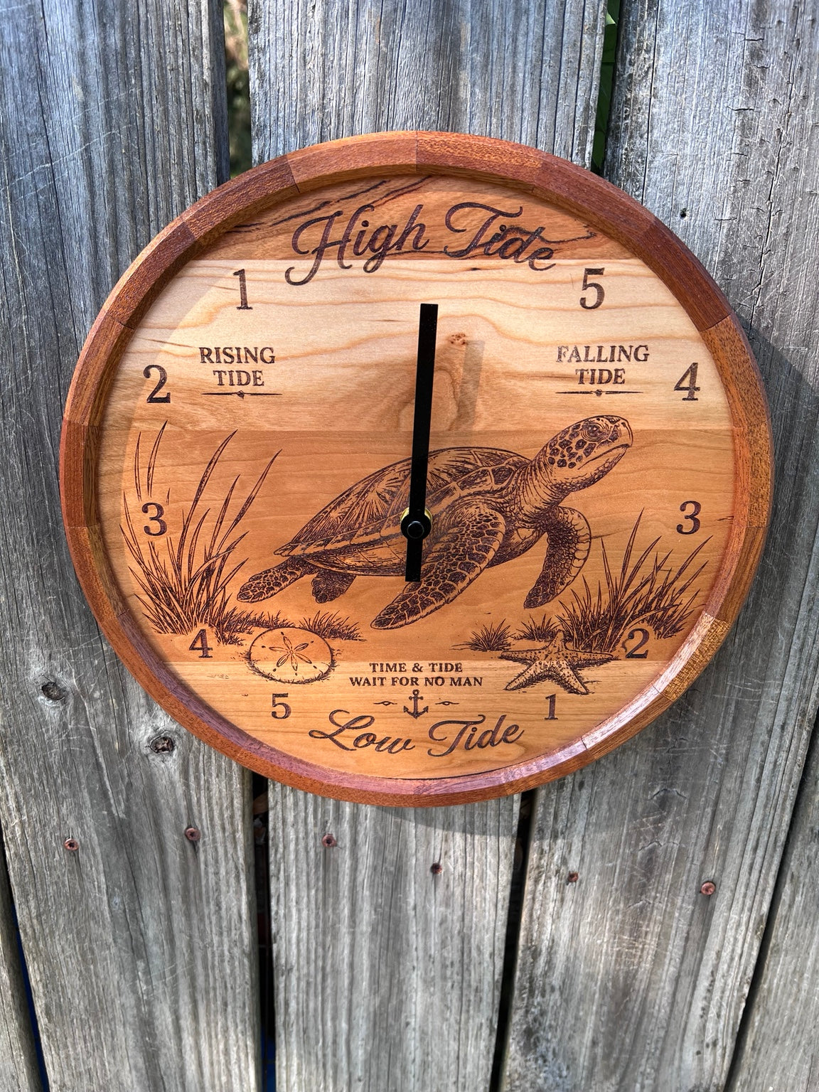 Front view of the sea turtle tide clock with segmented sapele ring