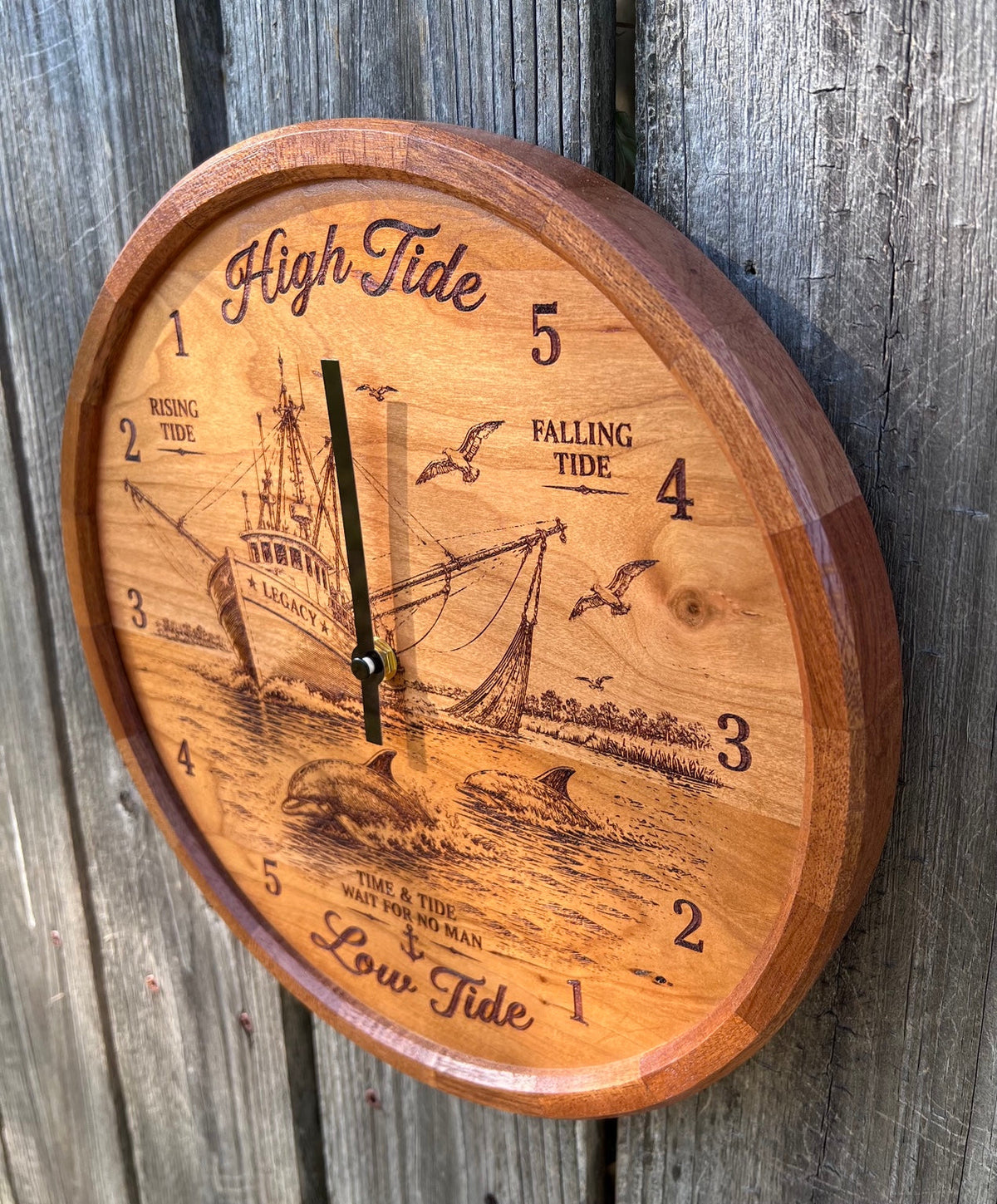 Angled view of the shrimp boat tide clock showing the segmented sapele ring